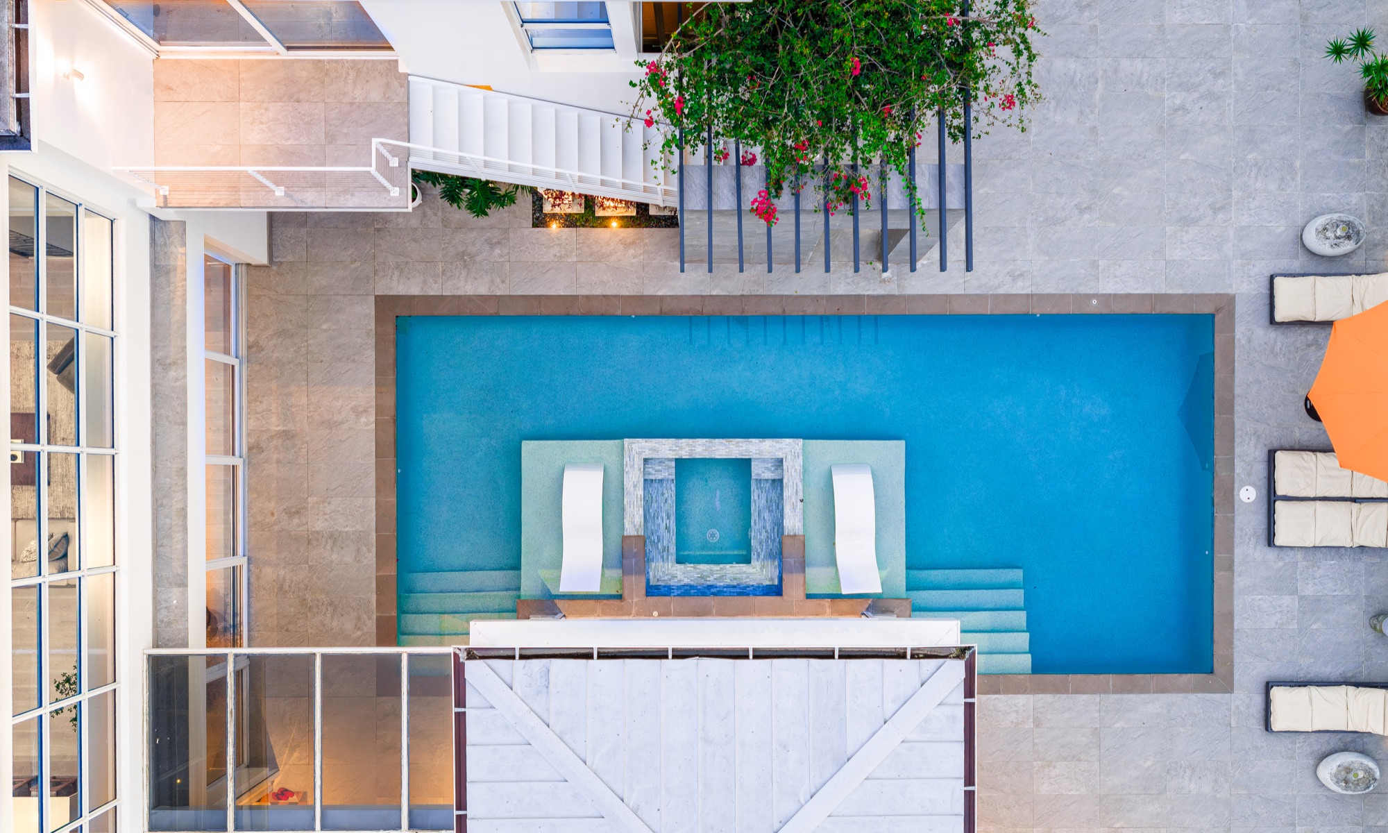 Overhead architectural view of a private pool courtyard in Coquina Sands, Naples