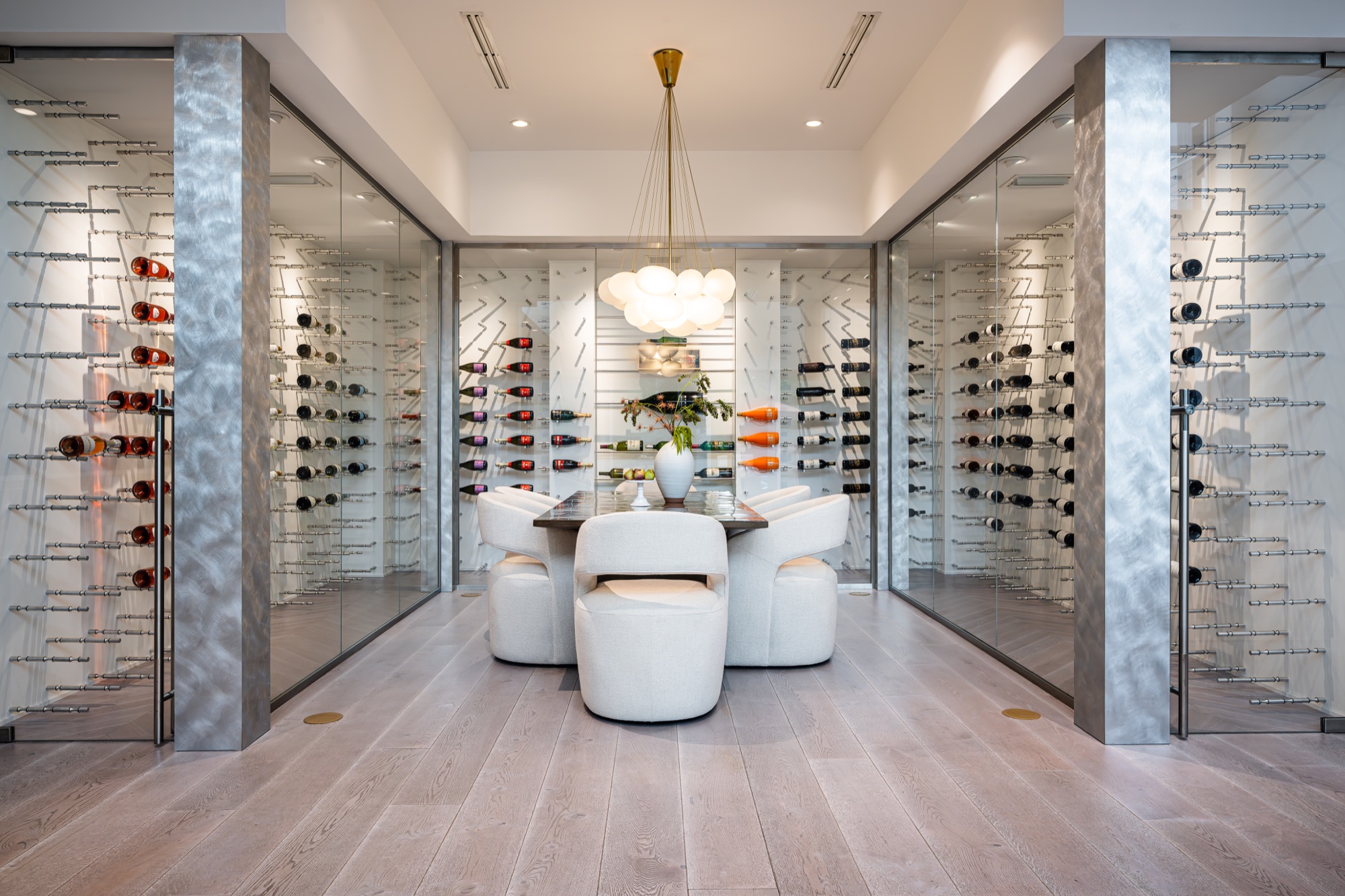 Architectural wine gallery and dining room in a Coquina Sands residence in Naples