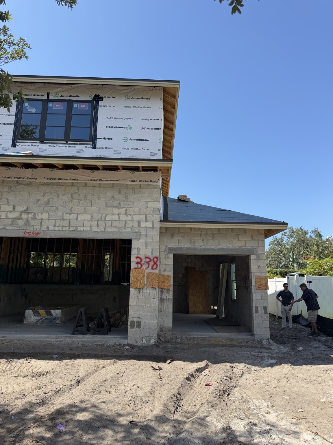 Earlier construction stage showing blockwork and upper-story framing at Snell Isle