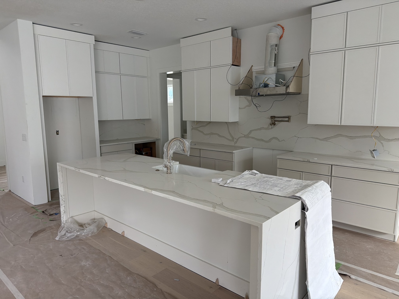 Kitchen cabinetry and stone installation underway at Snell Isle
